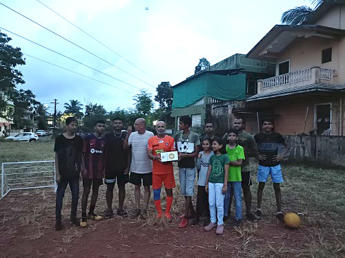 Surya colony kids happily receive sports kit.